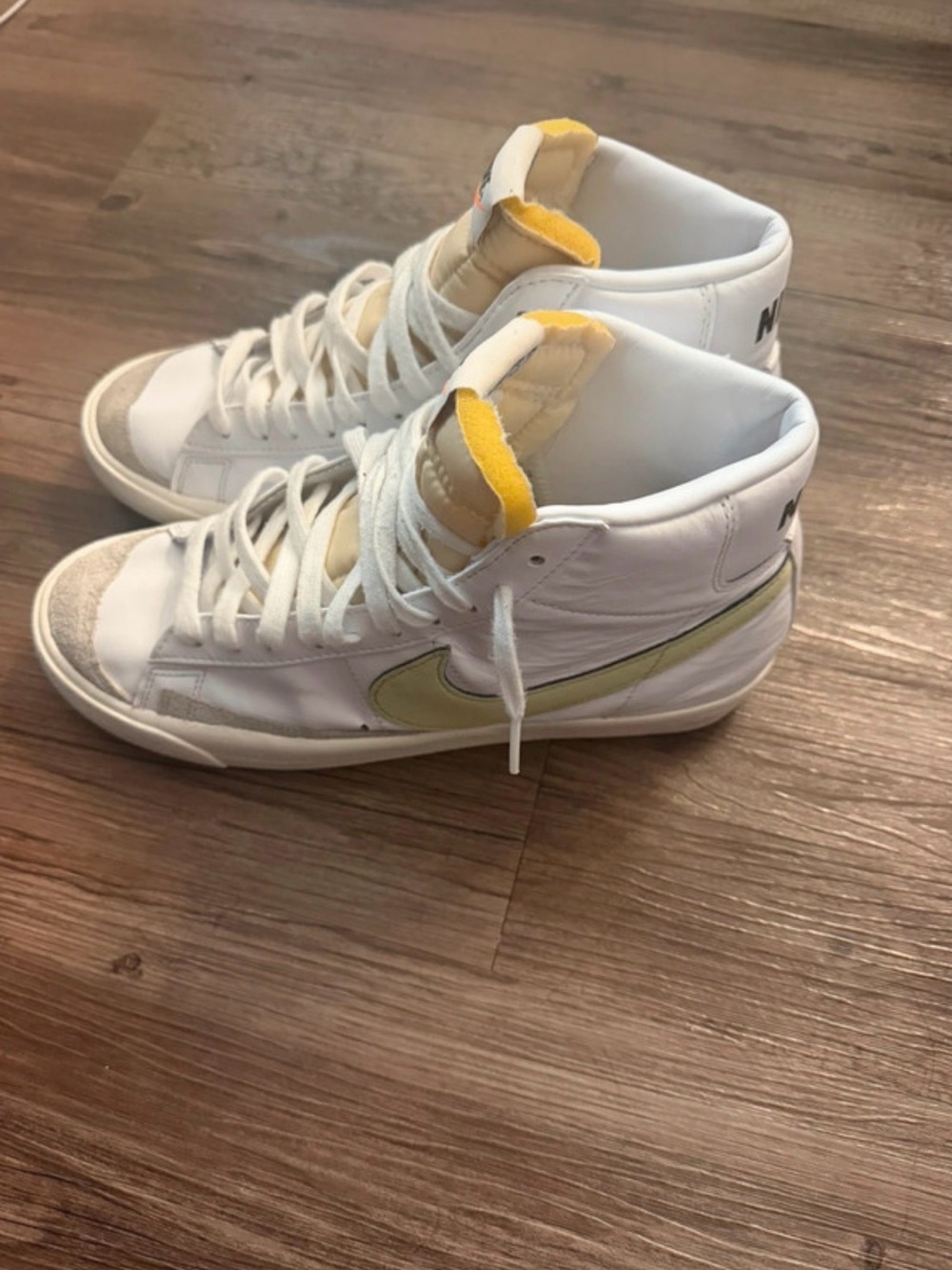 Nike Women’s White High-Top Sneakers with Yellow Swoosh